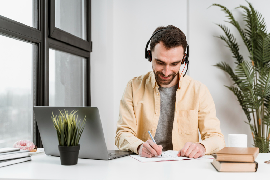man-with-headset-having-video-call-laptop.jpg