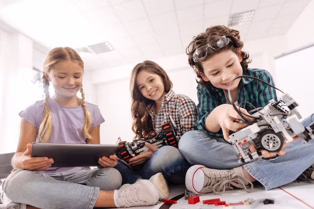studying-science-concept-delighted-cheerful-curious-children-sitting-in-the-science-classroom-and-using-gadgets-and-devices-while-expressing-joy_259150-14354.png